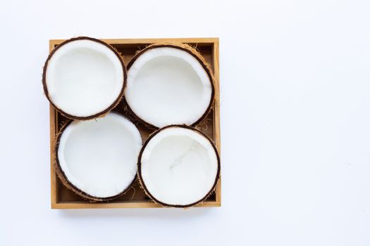 Top view of ripe coconuts in wooden box. Copy space