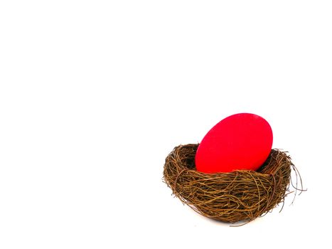 red easter egg in a bird nest, isolated on white backgound