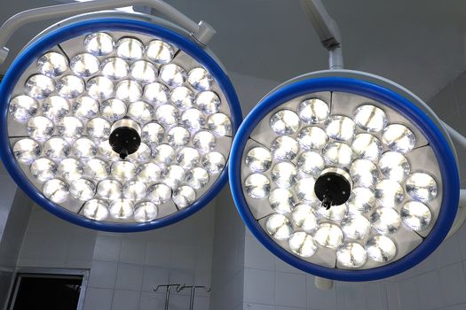 two operation room lamps, clean bright and modern device