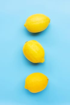 Fresh lemon on blue background. Top view
