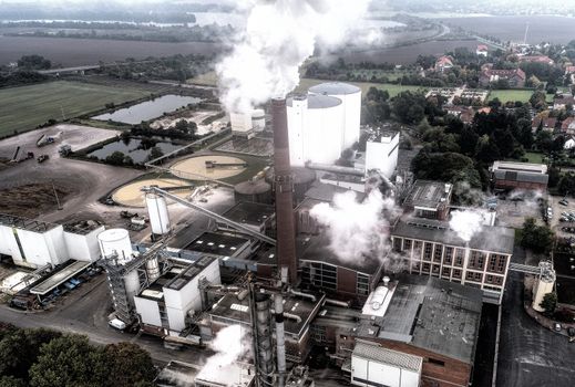 Aerial photo of a sugar factory during the beet campaign, photo taken with a drone, alienated image