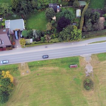 Aerial view of a road at a pasture. Abstract due to vertical angles from a height of 70 meters 