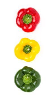 Fresh and delicious stoplight bell peppers isolated on white background. Flat lay.