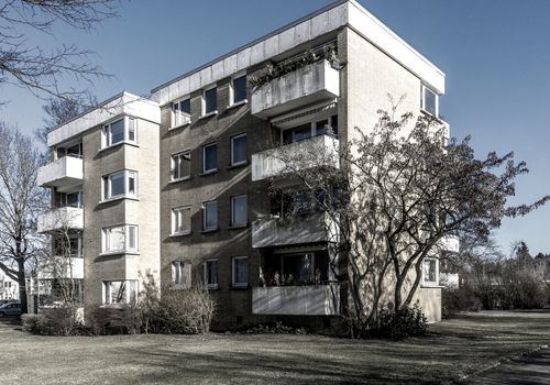 Ugly apartment block on the edge of an industrial city, alienated