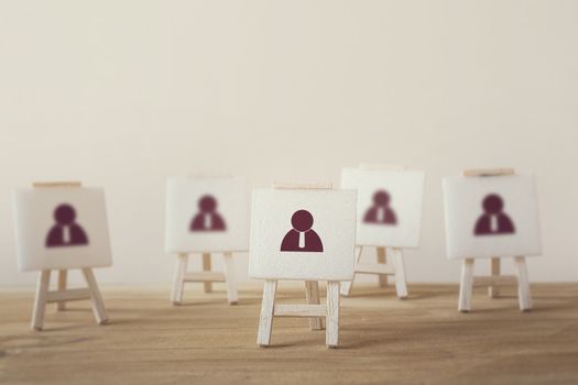 Business Leadership concept : Businessman icon with sign stand. Stand out from the crowd and think different. Select team leader, staff, building a good team, human resources and management.