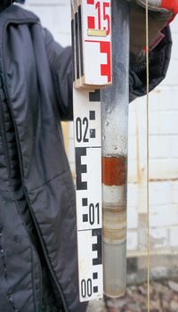 Floating oil in a sample from the groundwater on the site of a former tank farm 