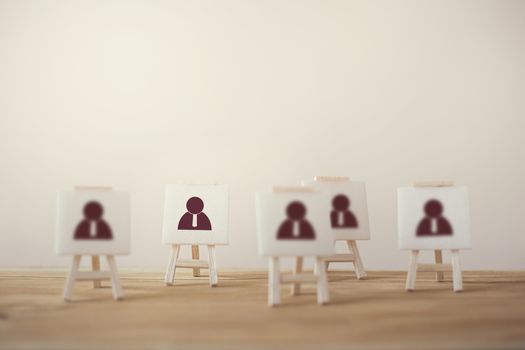 Business Leadership concept : Businessman icon with sign stand. Stand out from the crowd and think differently. Select leader, staff, building a good team, human resources and management.