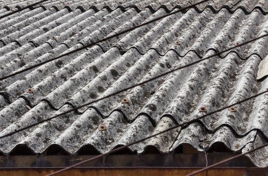 Old and dangerous asbestos roof, one of the most dangerous materials in the construction industry.