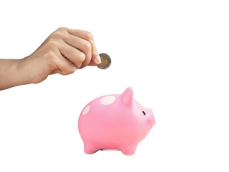 woman putting coin into piggy bank isolated on white background with clipping path. finance and saving money for future concept.
