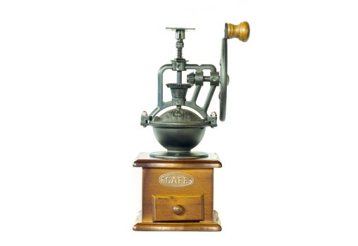 a vintage coffee grinder made of metal and wood, isolated on white background