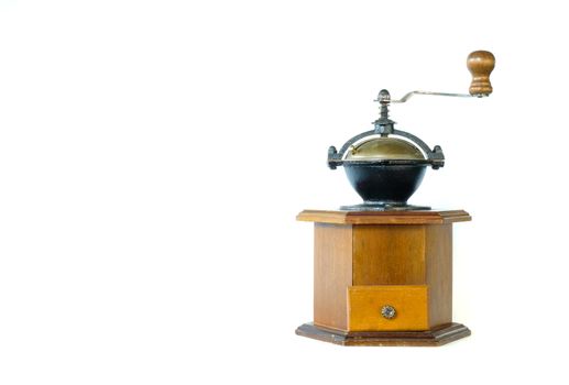 a vintage coffee grinder with metal bowl isolated on white background