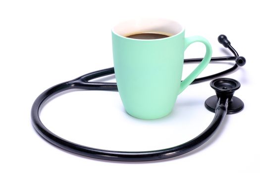 A stetchoscope and a green ceramic coffee mug isolated on white background, front view