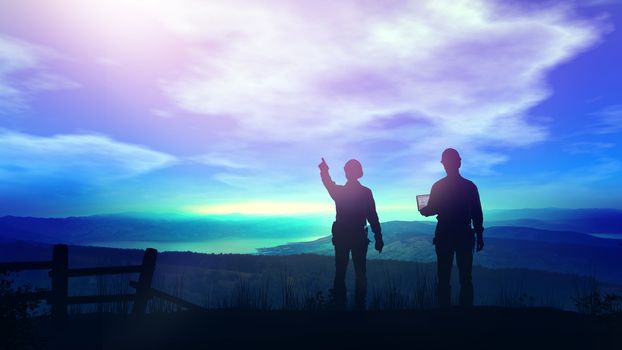 At dawn two silhouettes of construction engineers looking from a hill at a future building site.