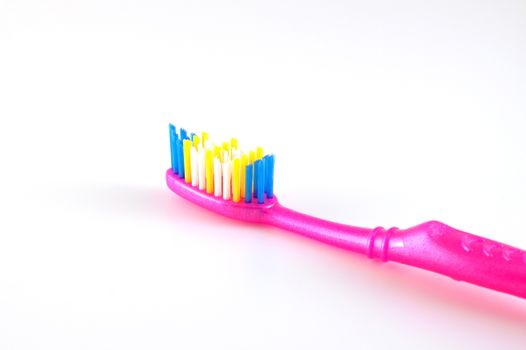 Tooth-brush over white. Shallow DOF.