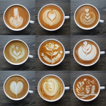 Collection of top view of latte art coffee mugs on timber background.