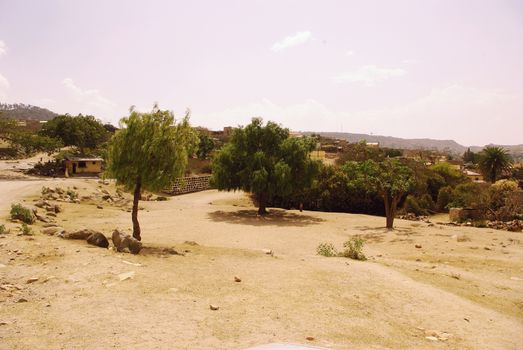 Eritrea, Africa - 08/10/2019: Travelling around the vilages near Asmara and Massawa. An amazing caption of the trees, mountains and some old typical houses with very hot climate in Eritrea.