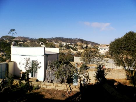 Eritrea, Africa - 08/10/2019: Travelling around the vilages near Asmara and Massawa. An amazing caption of the trees, mountains and some old typical houses with very hot climate in Eritrea.