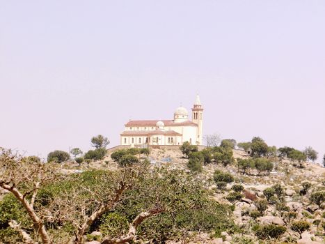 Eritrea, Africa - 08/10/2019: Travelling around the vilages near Asmara and Massawa. An amazing caption of the trees, mountains and some old typical houses with very hot climate in Eritrea.