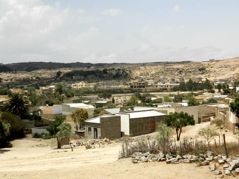 Eritrea, Africa - 08/10/2019: Travelling around the vilages near Asmara and Massawa. An amazing caption of the trees, mountains and some old typical houses with very hot climate in Eritrea.