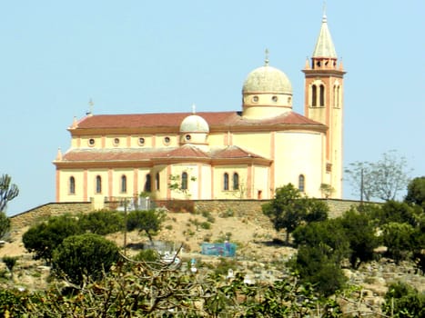 Eritrea, Africa - 08/10/2019: Travelling around the vilages near Asmara and Massawa. An amazing caption of the trees, mountains and some old typical houses with very hot climate in Eritrea.