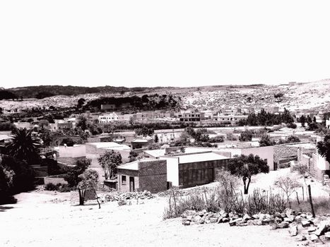 Eritrea, Africa - 08/10/2019: Travelling around the vilages near Asmara and Massawa. An amazing caption of the trees, mountains and some old typical houses with very hot climate in Eritrea.