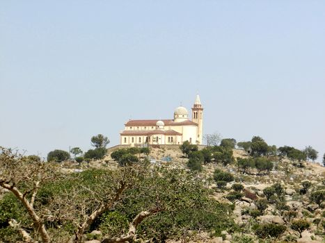 Eritrea, Africa - 08/10/2019: Travelling around the vilages near Asmara and Massawa. An amazing caption of the trees, mountains and some old typical houses with very hot climate in Eritrea.