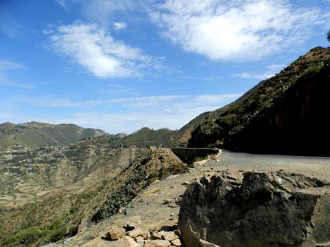 Eritrea, Africa - 08/10/2019: Travelling around the vilages near Asmara and Massawa. An amazing caption of the trees, mountains and some old typical houses with very hot climate in Eritrea.