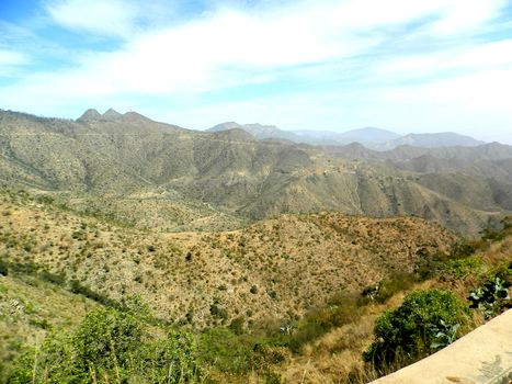 Eritrea, Africa - 08/10/2019: Travelling around the vilages near Asmara and Massawa. An amazing caption of the trees, mountains and some old typical houses with very hot climate in Eritrea.