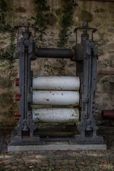old iron machine with rollers