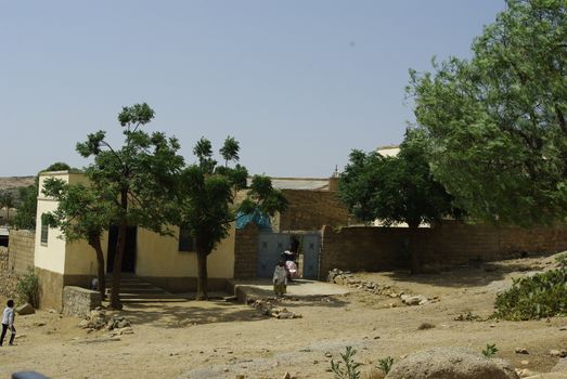 Eritrea, Africa - 08/10/2019: Travelling around the vilages near Asmara and Massawa. An amazing caption of the trees, mountains and some old typical houses with very hot climate in Eritrea.