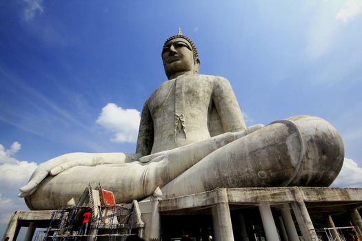 Large Buddha statue on a wide concrete base