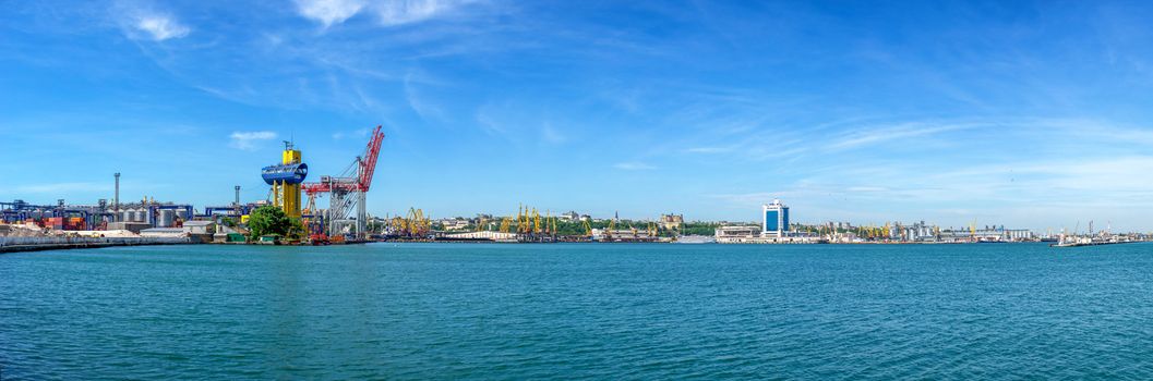 Lighthouse at the entrance to the harbor of Odessa seaport, on a sunny summer day