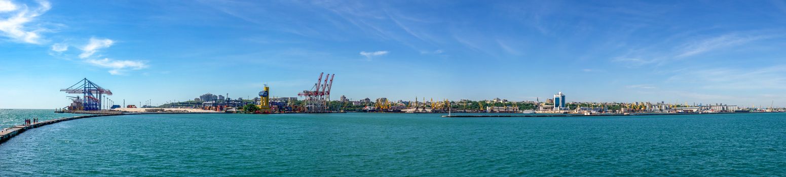 Lighthouse at the entrance to the harbor of Odessa seaport, on a sunny summer day