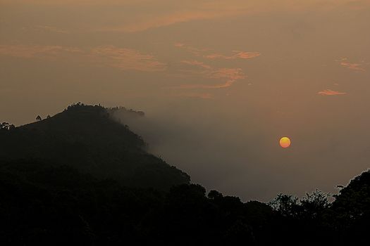Mountain landscape and sunset in the fog