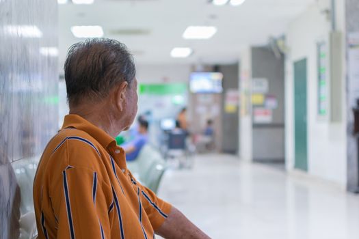 Patient elderly and many patient waiting a doctor and nurse in hospital