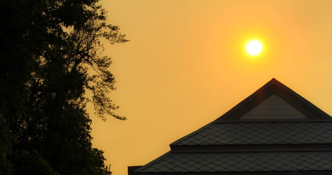 View of sunset in evening with silhouette of building. nature background.