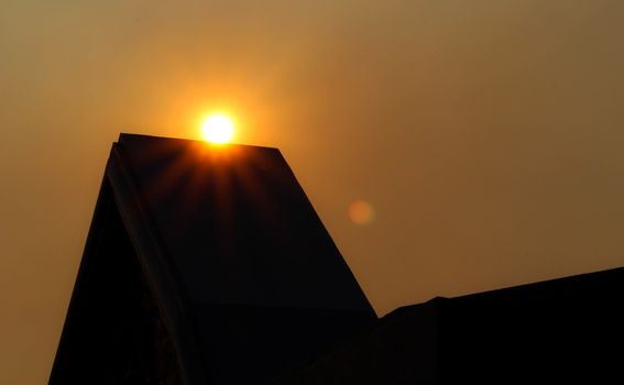 View of sunset in evening with silhouette of building. nature background.