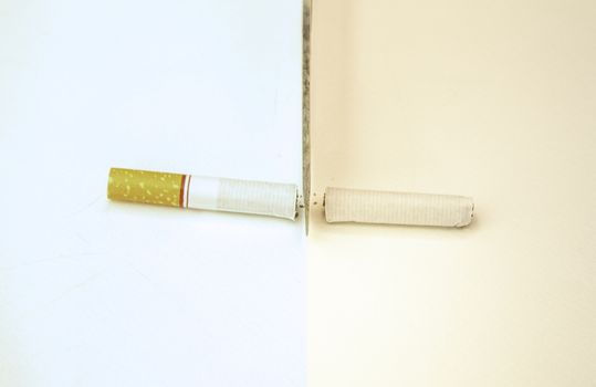 World No Tobacco Day; Use a knife to cut cigarettes isolated on white background. Cigarette destruction concept.