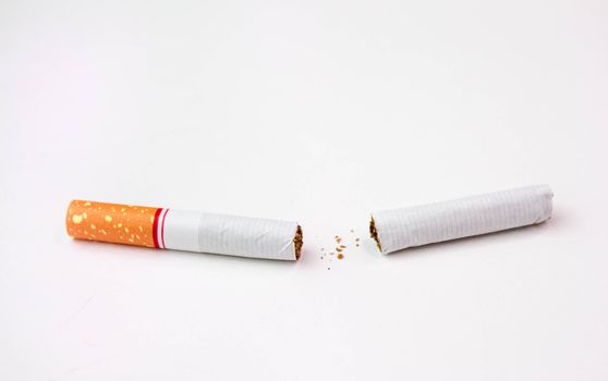 World No Tobacco Day; Broken cigarette isolated on white background. Cigarette destruction concept