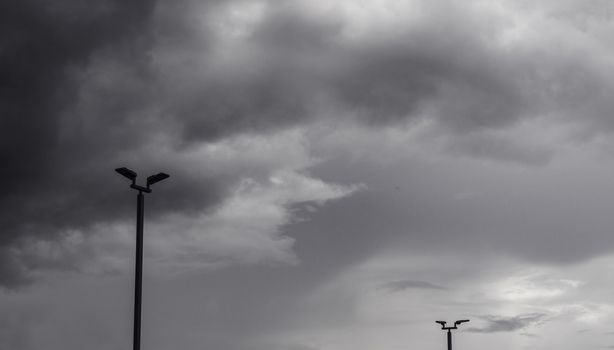 Dark gray dramatic sky with large clouds before rain.