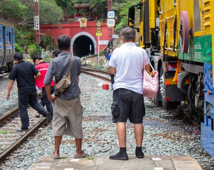 People waiting for Vintage diesel engine train at Khun Tan railway station, Lamphun Thailand.