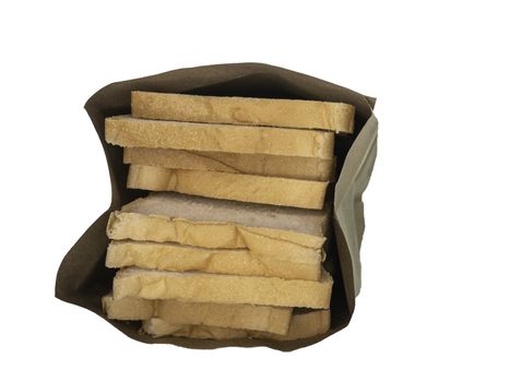 Bread full sliced in paper bag isolated on white background.