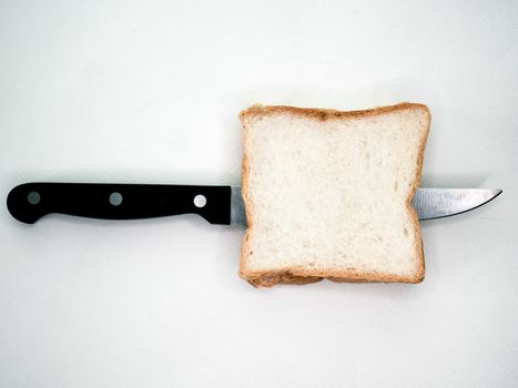 Sliced Bread with knife on white background.