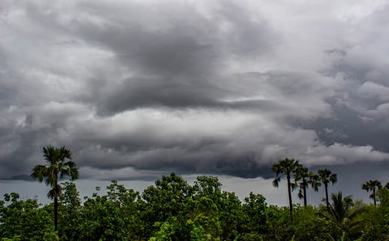 Dark gray dramatic sky with large clouds before rain in evening.