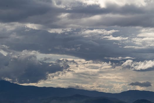 The Dark gray dramatic sky with large clouds in rainy seasons.