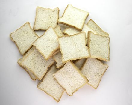 Heap of Stacked Sliced Bread on White Background.