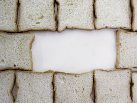Heap of Stacked Sliced Bread on White Background.