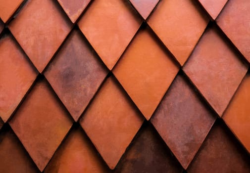 Close up texture of orange rhombus brick. Wall for exterior or interior design. Building material. Background concept.
