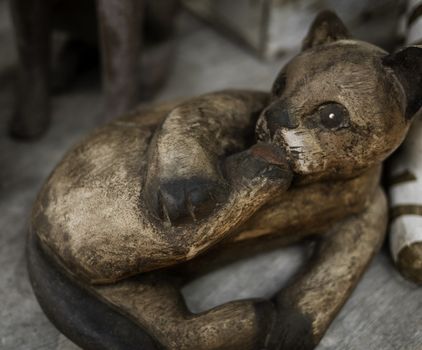 Close​ up​ Old wooden cat carved​​ in​ coffee​ cafe.