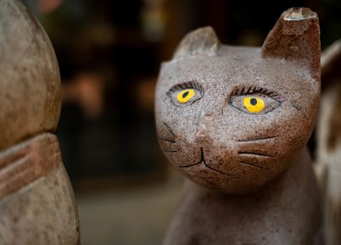 Close​ up​ Old wooden cat carved​​ in​ coffee​ cafe.